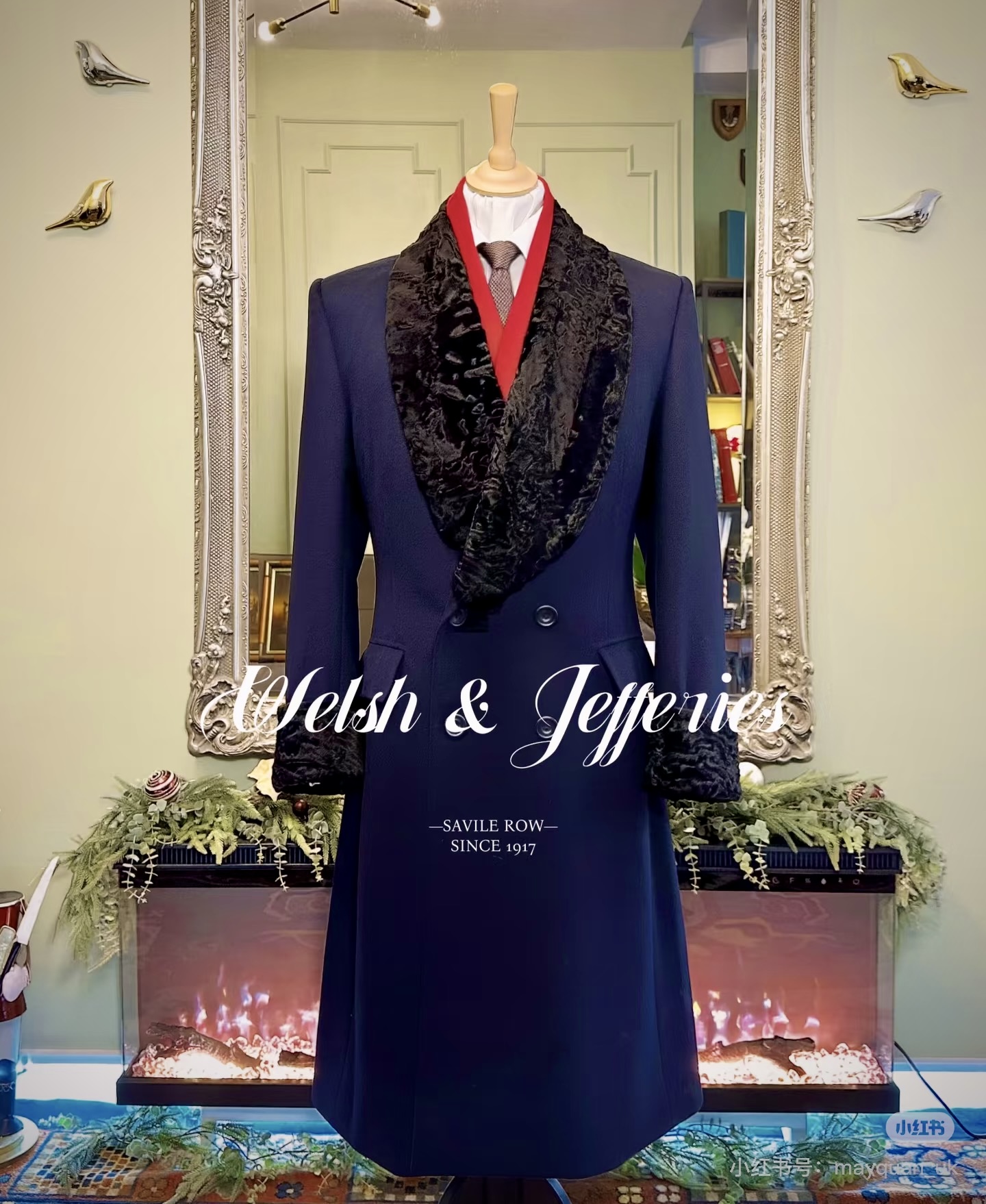 Midnight cashmere evening coat with an enveloping black astrakhan-style collar and cuffs.