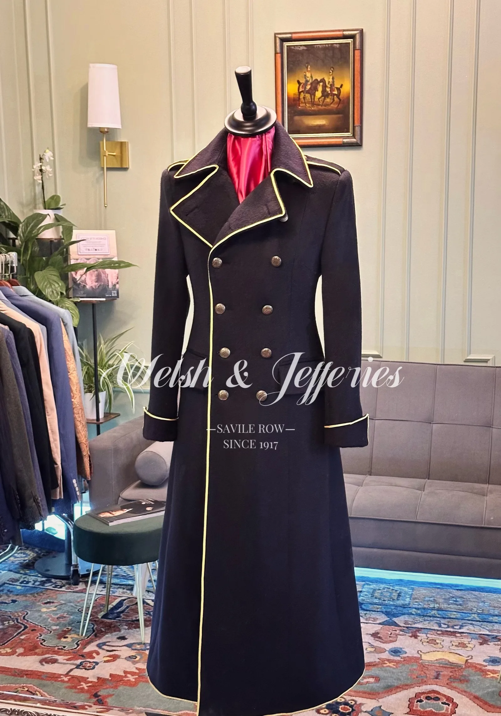 Front view of deep navy military coat with gold piping.